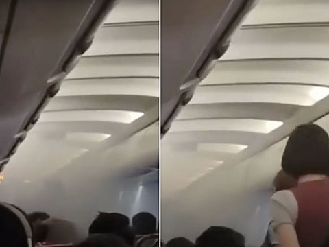 A screengrab from the video taken by a passenger and shared online shows smoke in the cabin of a Royal Air Philippines aircraft following a fire triggered by a powerbank explosion.