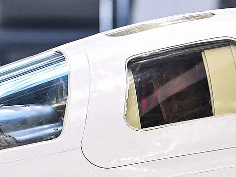 In this pool photograph distributed by Russian state agency Sputnik, Russia's President Vladimir Putin is seen in the cockpit of a Tupolev Tu-160M strategic bomber while visiting the Gorbunov Kazan Aviation Plant in Kazan on February 22, 2024. 