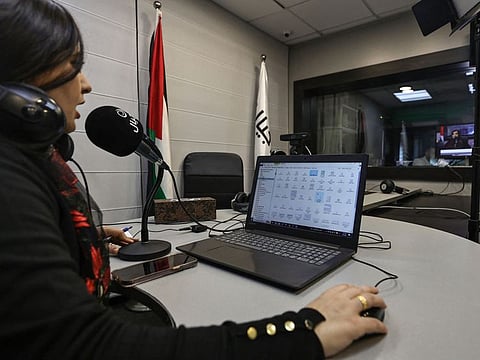 Palestinian radio presenter Maysam Barghouti, 36, at Radio Ajyal, a station based in the occupied West Bank city of Ramallah that features personal messages from families of prisoners held in Israeli jails.
