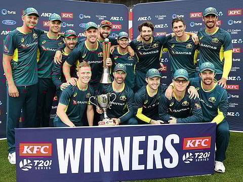 Australia players pose as they celebrate winning the series 3-0 after the third Twenty20 international cricket match between New Zealand and Australia at Eden Park in Auckland on February 25, 2024.