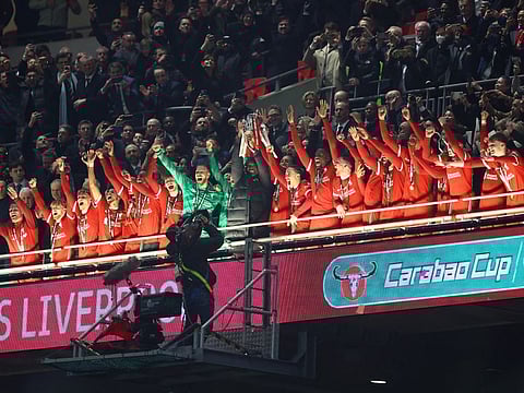 Liverpool manager Juergen Klopp, Virgil van Dijk and teammates celebrate winning the Carabao Cup at Wembley Stadium, London, Britain, on Sunday