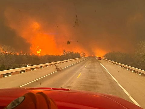 A fire truck driving towards the Smokehouse Creek Fire, near Amarillo, in the Texas Panhandle.