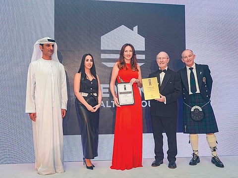 Diana Magariu, CEO of Key One Realty Group (third from right) at the award ceremony.