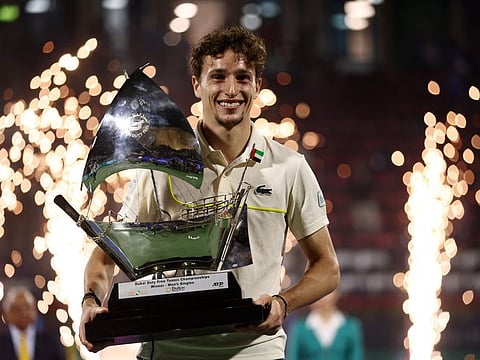 France's Ugo Humbert poses with the trophy after winning the final against Kazakhstan's Alexander Bublik in the Dubai Tennis Championships at Dubai Duty Free Tennis Stadium.