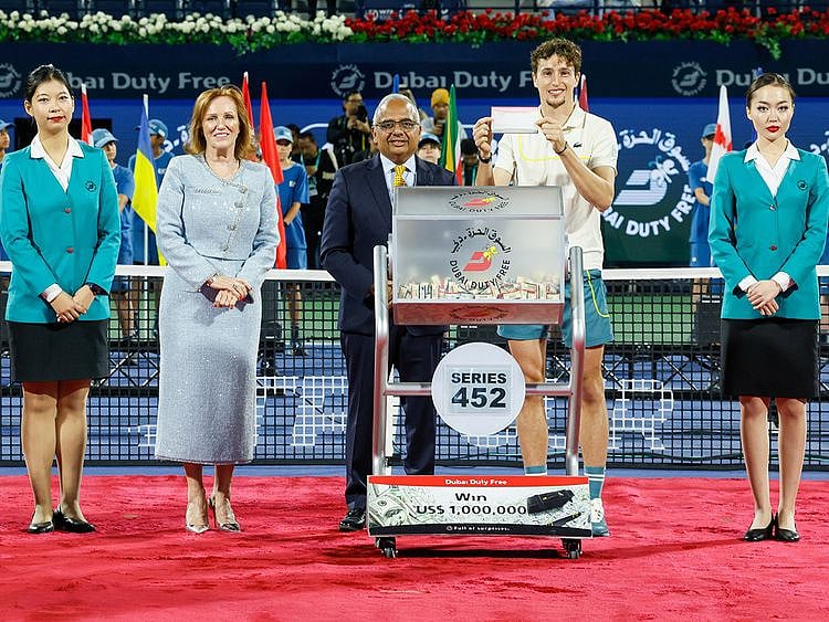 Dubai-Duty-Free-Tennis-Championships-winner-Ugo-Humbert-with-Dubai-Duty-Free-officials-conducted-the-draw-for-Dubai-Duty-Free-Millennium-Millionaire-Series--452-1709454364990