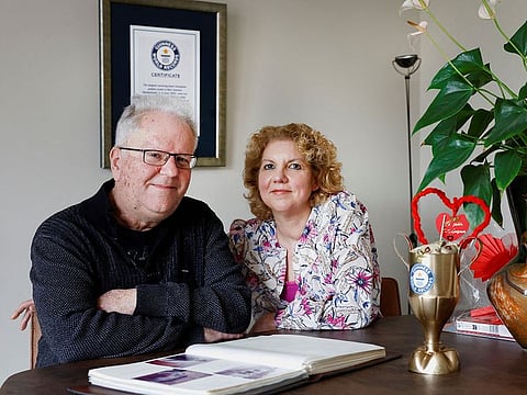 Bert Janssen, 57 years old, and his wife Petra pose in their house in Herkenbosch, Netherlands February 29, 2024