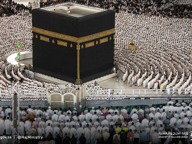 Umrah pilgrims perform prayers around the Holy Kaaba at the Grand Mosque in Mecca.  