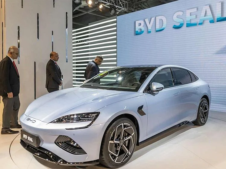 Tata Sons Ltd. Chairman Natarajan Chandrasekaran, right, checks out a BYD Co. Seal electric sedan showcased at the India Auto Expo 2023 on January 11, 2023. 