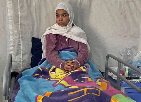 This picture taken on March 6, 2024 shows Palestinian girl Hala Hazem Hamada taking rest in a hospital in Rafah.  