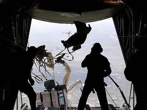 A picture released on March 7, 2024, by the Jordanian Armed Forces website shows what it said was aid being air-dropped over Gaza, in an operation it said was being carried out with the participation of Egypt, the United States, France, Netherlands and Belgium.   