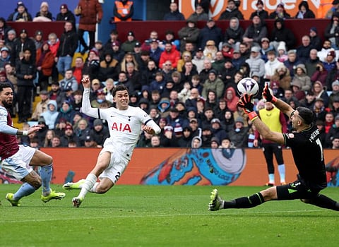 Tottenham Hotspur's Brennan Johnson scores their second goal past Aston Villa's Emiliano Martinez during their Premier League match at Villa Park, Birmingham on Sunday.