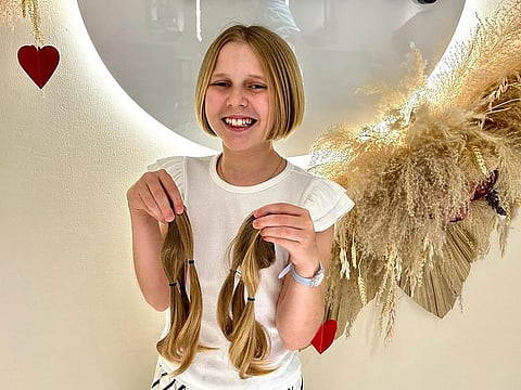 Aurelia Reeves was inspired to donate hair to a wig charity to mark the anniversary of her stem cell treatment for a rare disease.