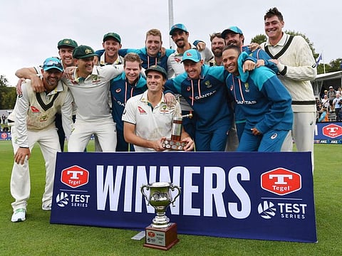Australia's players celebrate after winning the series following their victory of the second Test cricket match against New Zealand at Hagley Oval in Christchurch on Monday.