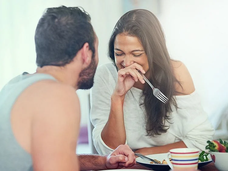 Two people laughing