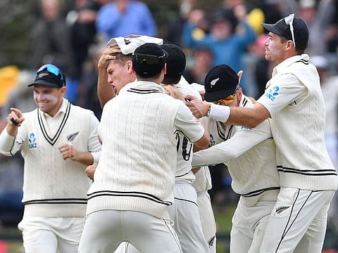 New Zealand's Ben Sears (2nd L) is congratulated by teammates after dismissing Australia's Mitchell Starc on day four of the second Test cricket match at Hagley Oval in Christchurch on March 11.