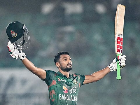 Bangladesh's captain Najmul Hossain Shanto celebrates after scoring a century during the first ODI cricket match against Sri Lanka at the Zahur Ahmed Chowdhury Stadium in Chittagong on Wednesday.