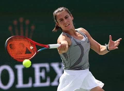 Emma Navarro of the United States powers a forehand return against Aryna Sabalenka in their fourth round match during the BNP Paribas Open at Indian Wells Tennis Garden on Wednesday.