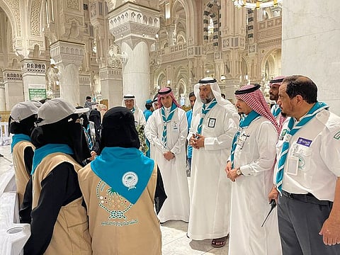 Director-General of Education in Mecca Abdullah Al Ghanam inspects scouts who serve worshippers and Umrah pilgrims at the Grand Mosque in Mecca.