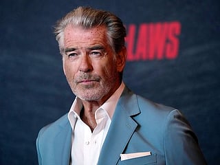 Pierce Brosnan pleads guilty to walking off trail at Yellowstone hot springs, must pay $1,500