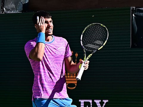 Spain's Carlos Alcaraz reacts to a swarm of bees during his men's quarter-final against Germany's Alexander Zverev during the Indian Wells on Thursday.