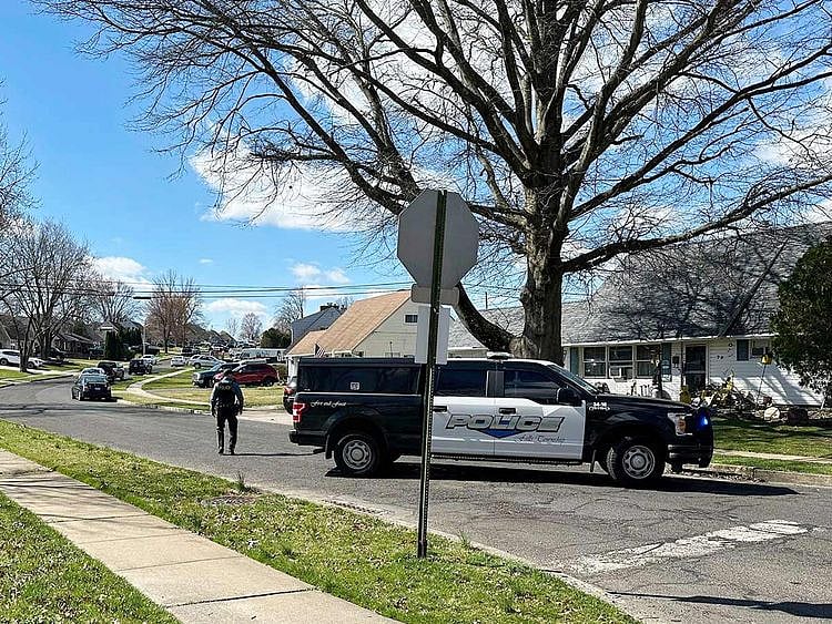 Police patrol a neighbourhood after a shooting on Saturday, March 16, 2024 in Levittown, Pennsylvania.