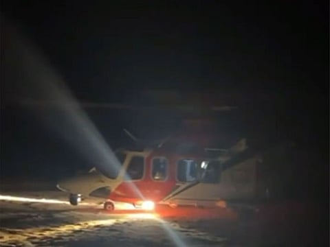 National Guards evacuate two people after vehicle overturns in Liwa Desert.