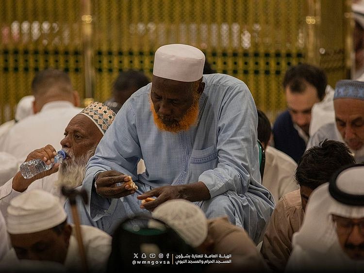 Muslims end their day-long fast at the Prophet’s Mosque in Medina. 
