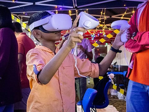 A young visitor checks out an AR device at STEAM@BITS last year