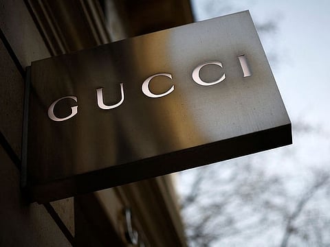 A Gucci sign is seen outside a shop in Paris, France.