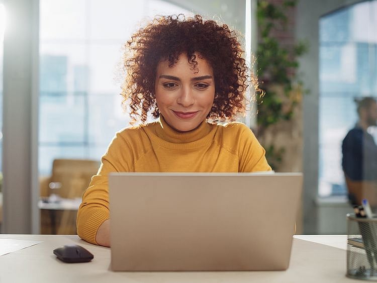 Person looking at their laptop