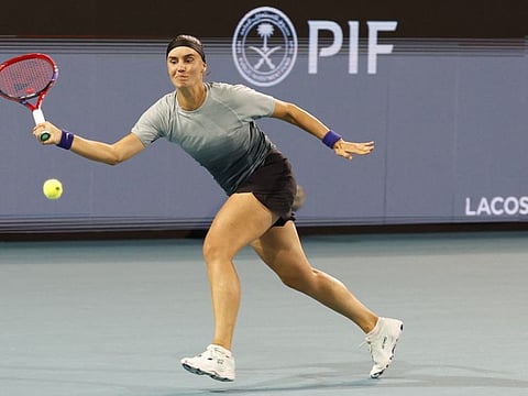 Anhelina Kalinina reaches for a forehand against Aryna Sabalenka on day six of the Miami Open at Hard Rock Stadium.