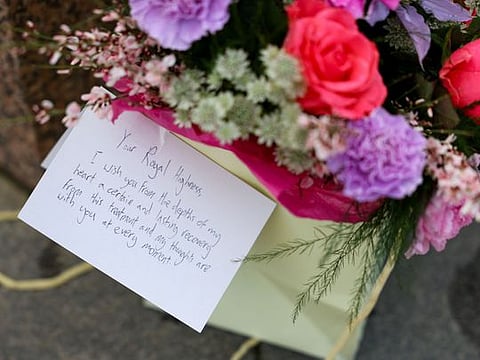 Flowers and a letter to the Princess of Wales were left outside Windsor Castle in Windsor, England, Saturday, March 23, 2024.  