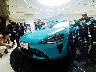 Xiaomi CEO teases price on upcoming car, showrooms begin displaying SU7