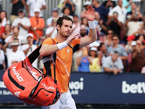 Andy Murray of Great Britain waves to the crowd after losing against Tomas Machac of the Czech Republic during the Miami Open at Hard Rock Stadium on Sunday.
