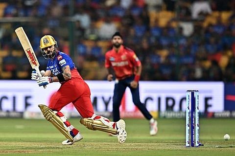 Royal Challengers Bengaluru's Virat Kohli flicks one down the line during the Indian Premier League cricket match against Punjab Kings at the M. Chinnaswamy Stadium in Bengaluru on Monday.