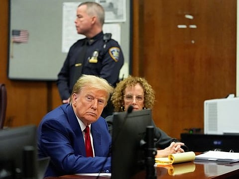 Former US President Donald Trump awaits the start of a pre-trial hearing, on charges stemming from hush money paid to a porn star, in New York City, on March 25, 2024.  