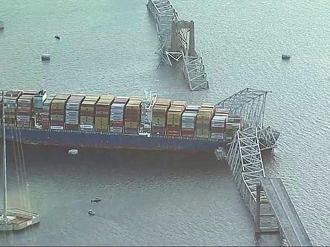 Parts of the Francis Scott Key Bridge remain after a container ship collided with one of the bridge’s support Tuesday, March 26, 2024 in Baltimore. The major bridge in Baltimore snapped and collapsed after a container ship rammed into it early Tuesday, and several vehicles fell into the river below.  
