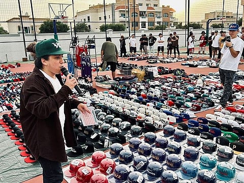 Gene Delos Reyes at the LATAGAN SA GITNANG SILANGAN event in Dubai last week. Over 3,100 caps were on display at the event.