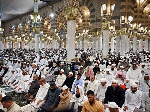 The faithful pray at the Prophet's Mosque in Medina.  