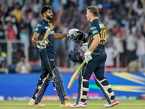 Gujarat Titans' David Miller and his teammate Vijay Shankar (left) celebrate after winning the Indian Premier League cricket match against Sunrisers Hyderabad at the Narendra Modi Stadium in Ahmedabad on Sunday.