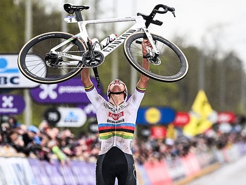 Dutch Mathieu van der Poel of Alpecin-Deceuninck celebrates after winning the men's race of Tour des Flandres on Sunday.