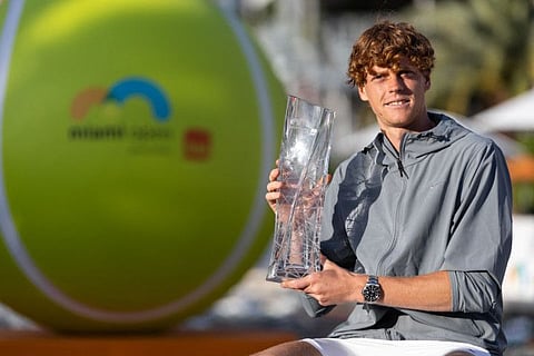 Jannik Sinner of Italy poses with the Miami Open trophy at Hard Rock Stadium in Miami Gardens, Florida, on Sunday.