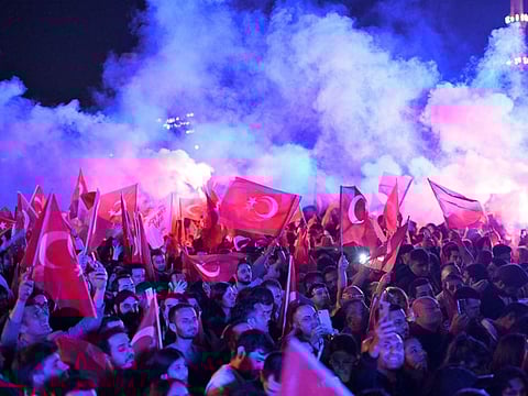 Opposition Republican People's Party (CHP) supporters celebrate outside the main municipality building following municipal elections across Turkey, in Istanbul on March 31, 2024.  