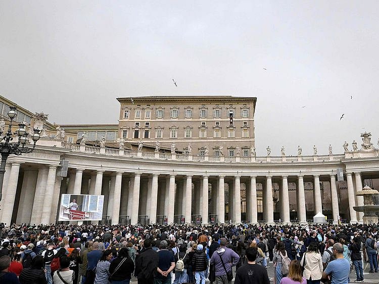 The crowd looks in direction of the window of the apostolic palace overlooking St. Peter’s square during Pope Francis’ Regina Coeli prayer on April 1st, 2024 in The Vatican.