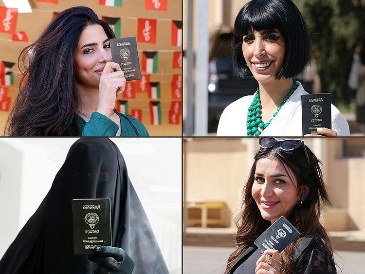  Kuwaiti women display their passports as they arrive to vote in parliamentary elections at a polling station in Kuwait City on April 4, 2024.