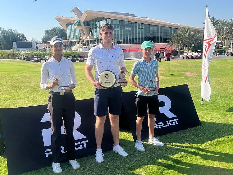 Overall champion Joe Jones (centre) with Divisional winners Lavanya Gupta (l) and Alexander Rushika (r) at the prize presentation of the Robert Rock Golf Championship at Abu Dhabi Golf Club