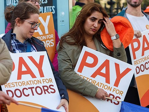 Health workers protest on a picket line as junior and senior doctors in England take part in a joint strike action for the first time, outside St Thomas’s Hospital in London, Britain September 20, 2023.
