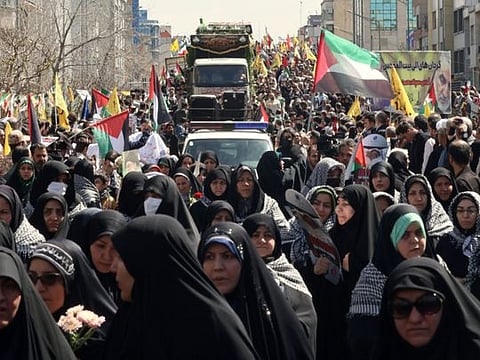 Iranians attend the funeral of seven Revolutionary Guard Corps members killed in a strike on the country's consular annex in Damascus, which Tehran blamed on Israel, on April 5, 2024, during their funeral procession in Tehran.  