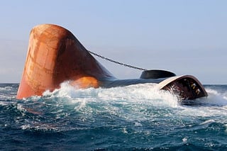 This picture taken on March 23, 2024 shows the Rubymar cargo ship partly submerged off the coast of Yemen. The bulk carrier went down off Yemen after a Houthi missile attack and poses grave environmental risks as thousands of tonnes of fertiliser threaten to spill into the Red Sea, officials and experts warn.  