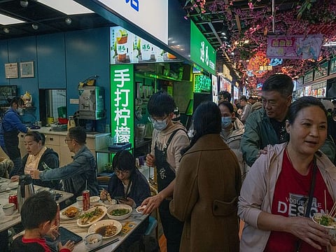 A food store at Dongmenting night market in Shenzhen, China, on Monday, February 12, 2024. Hong Kong residents are flocking to nearby mainland cities in record numbers for cheaper shopping and entertainment
